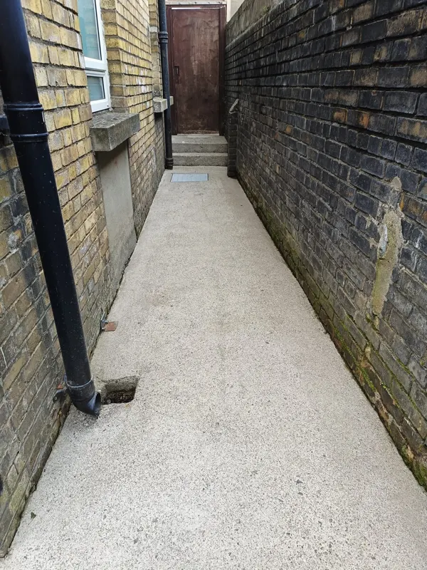 Concrete after — side passage washed clean
