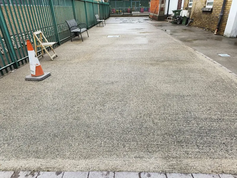 Concrete after — yard power washed to a clean, even finish