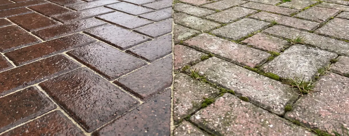 Driveway half restored — sealed block paving beside untreated moss and weeds