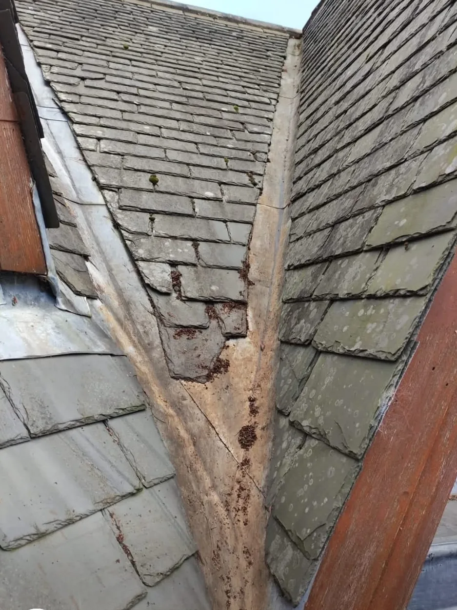 The same roof valley cleared down to the lead