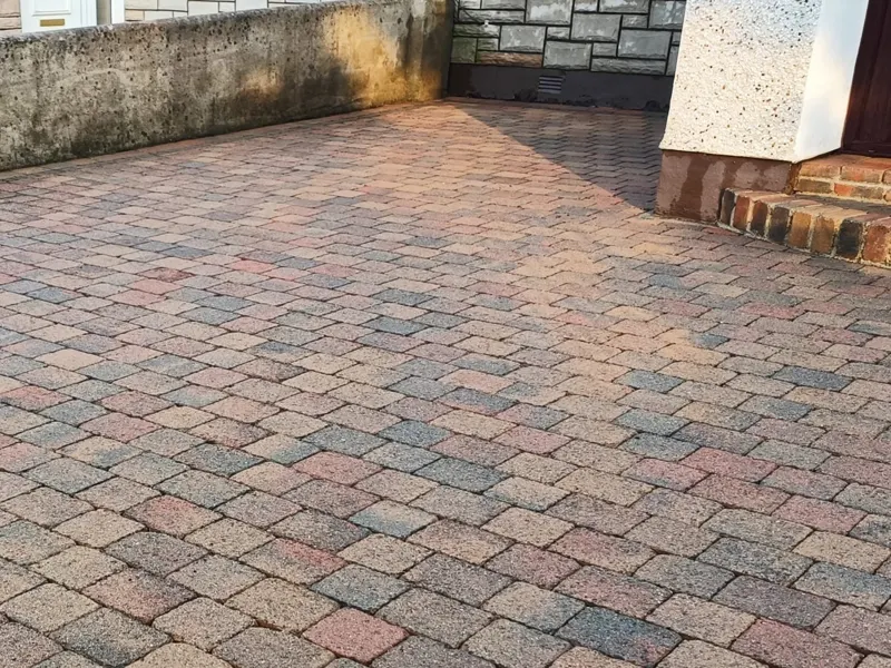 Block paving driveway fully power washed, bright and even