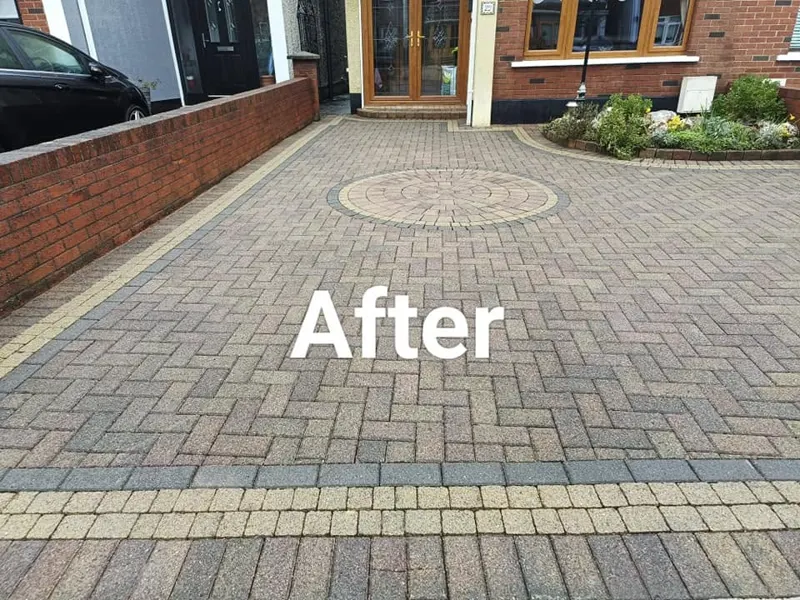 The same herringbone driveway after power washing, colour back in the blocks