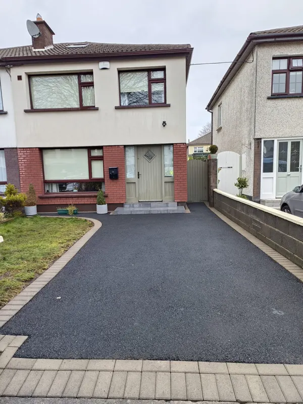 The same tarmac driveway cleaned to a deep even black