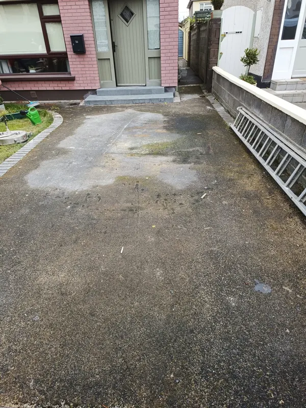 Tarmac driveway stained and patchy before cleaning
