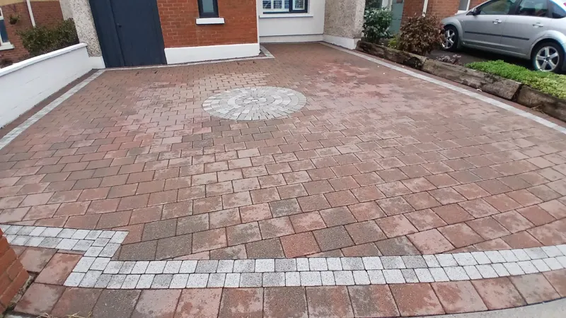 Freshly power washed block paving drying out before re-sanding